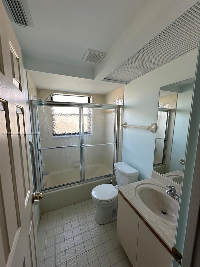 6081 SE Landing Way Unit 8, Stuart, FL 34997 - full bathroom featuring tile patterned floors, enclosed tub / shower combo, and vanity