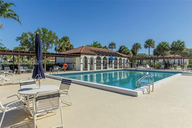 6081 SE Landing Way Unit 8, Stuart, FL 34997 - community pool featuring a patio area