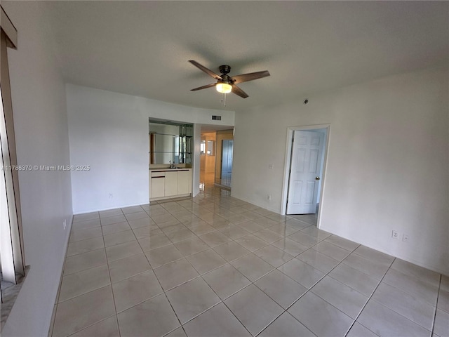 6081 SE Landing Way Unit 8, Stuart, FL 34997 - unfurnished room with ceiling fan, light tile patterned floors, and a sink