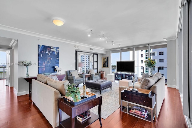 3101 S Ocean Dr Unit 701, Hollywood, FL 33019 - living room with crown molding, plenty of natural light, dark wood finished floors, and baseboards
