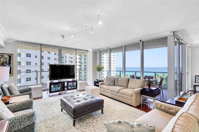 3101 S Ocean Dr Unit 701, Hollywood, FL 33019 - living area with floor to ceiling windows, wood finished floors, and ornamental molding