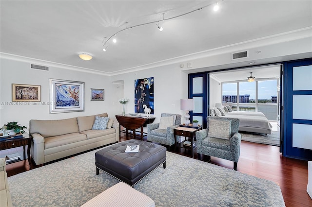 3101 S Ocean Dr Unit 701, Hollywood, FL 33019 - living area with dark wood finished floors, rail lighting, and crown molding