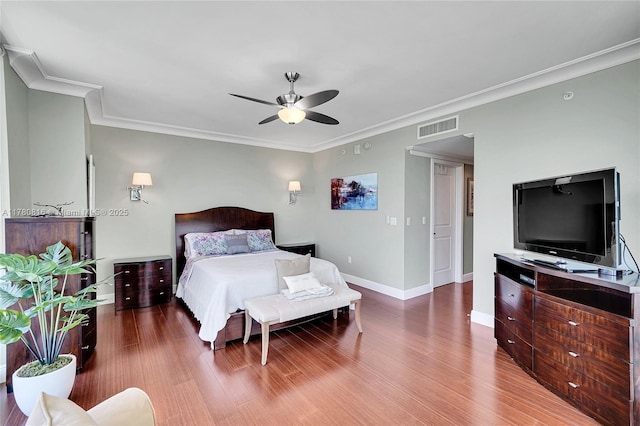 3101 S Ocean Dr Unit 701, Hollywood, FL 33019 - bedroom with baseboards, ornamental molding, wood finished floors, and ceiling fan