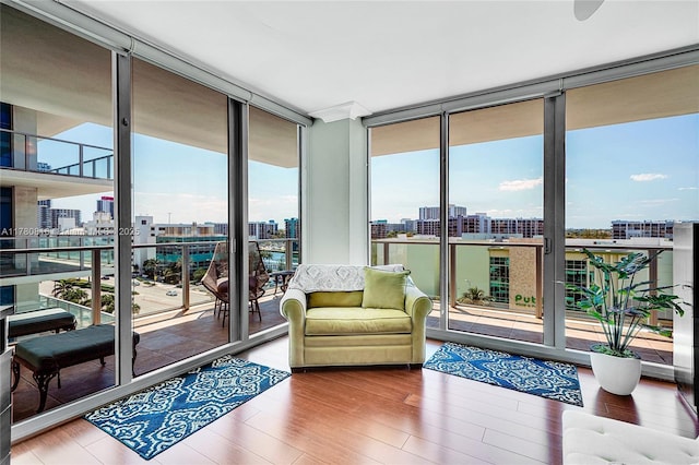 3101 S Ocean Dr Unit 701, Hollywood, FL 33019 - living area featuring a city view, floor to ceiling windows, and wood finished floors