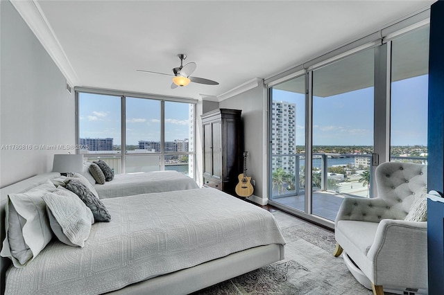 3101 S Ocean Dr Unit 701, Hollywood, FL 33019 - bedroom featuring a view of city, ornamental molding, expansive windows, access to outside, and a water view