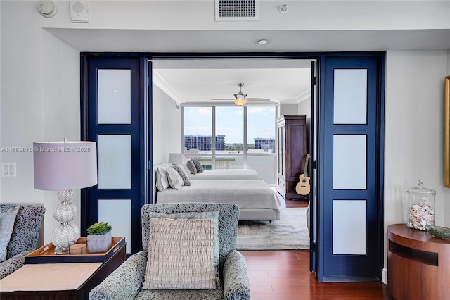3101 S Ocean Dr Unit 701, Hollywood, FL 33019 - bedroom with ornamental molding, dark wood finished floors, and a wall of windows