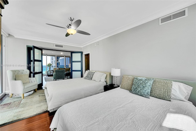 3101 S Ocean Dr Unit 701, Hollywood, FL 33019 - bedroom featuring crown molding, wood finished floors, and a ceiling fan
