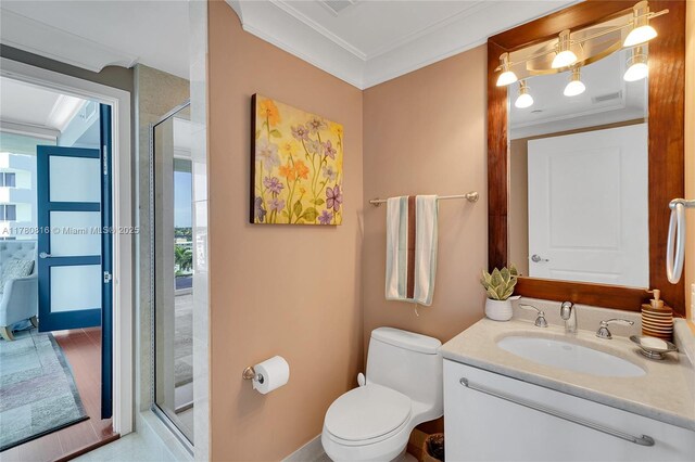 3101 S Ocean Dr Unit 701, Hollywood, FL 33019 - bathroom with vanity, crown molding, toilet, and a shower with shower door