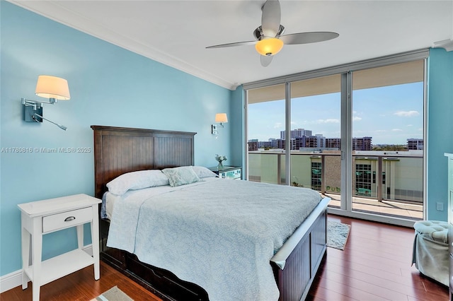 3101 S Ocean Dr Unit 701, Hollywood, FL 33019 - bedroom featuring a wall of windows, access to exterior, dark wood-style flooring, crown molding, and ceiling fan