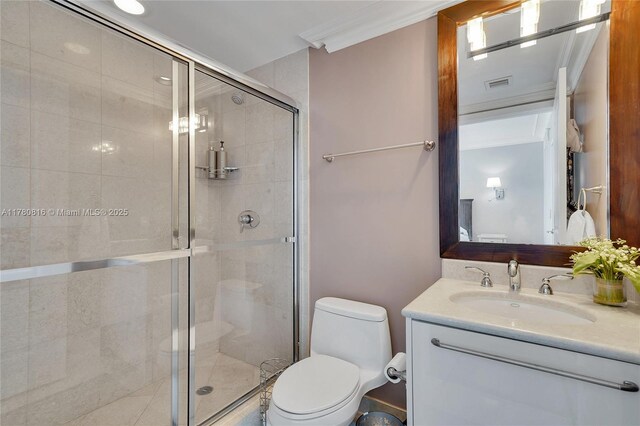 3101 S Ocean Dr Unit 701, Hollywood, FL 33019 - full bathroom with toilet, vanity, a shower stall, and ornamental molding