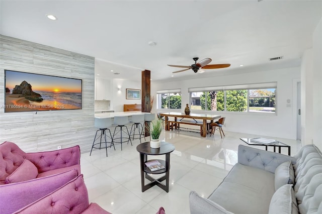 2506 NE 30th St, Fort Lauderdale, FL 33306 - living area with light tile patterned floors, recessed lighting, a ceiling fan, tile walls, and baseboards