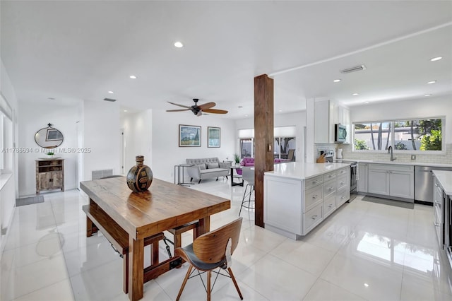 2506 NE 30th St, Fort Lauderdale, FL 33306 - dining area featuring ceiling fan, recessed lighting, and light tile patterned floors