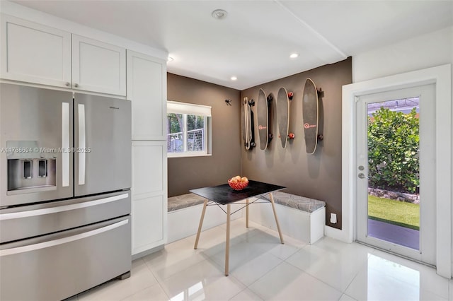2506 NE 30th St, Fort Lauderdale, FL 33306 - kitchen featuring stainless steel refrigerator with ice dispenser, white cabinetry, and recessed lighting