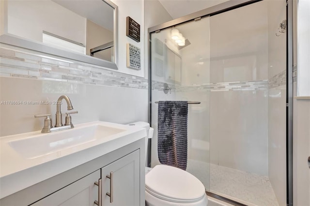 2506 NE 30th St, Fort Lauderdale, FL 33306 - bathroom featuring a stall shower, vanity, toilet, and tile walls
