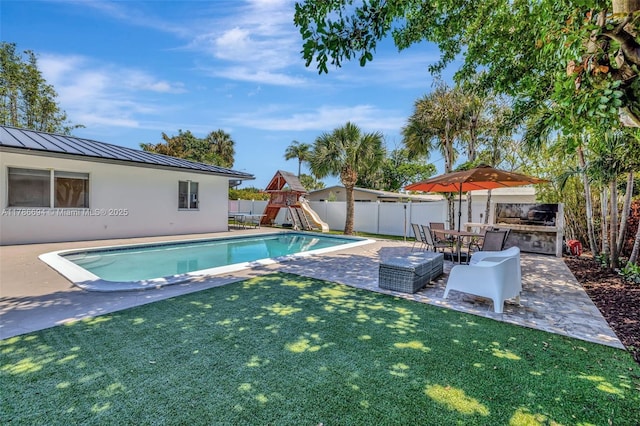 2506 NE 30th St, Fort Lauderdale, FL 33306 - view of pool with a patio area, a playground, and area for grilling
