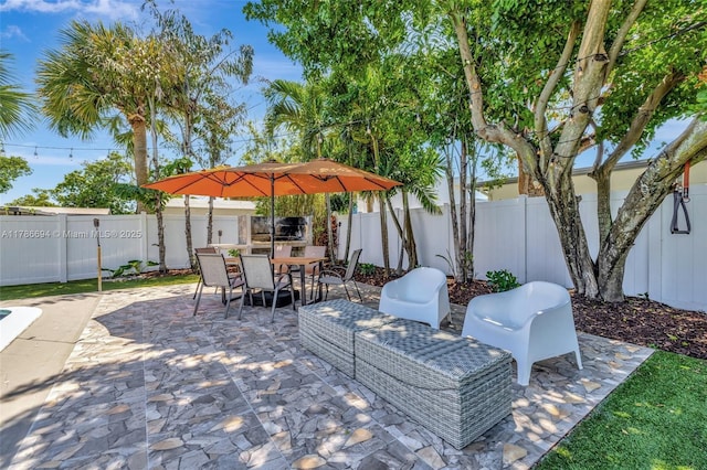2506 NE 30th St, Fort Lauderdale, FL 33306 - fenced backyard featuring a patio and outdoor dining space