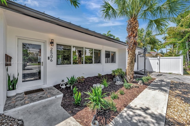 2506 NE 30th St, Fort Lauderdale, FL 33306 - entrance to property featuring a gate and stucco siding