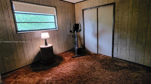 521 N 70th Way, Hollywood, FL 33024 - unfurnished bedroom with wooden walls, carpet flooring, and a closet