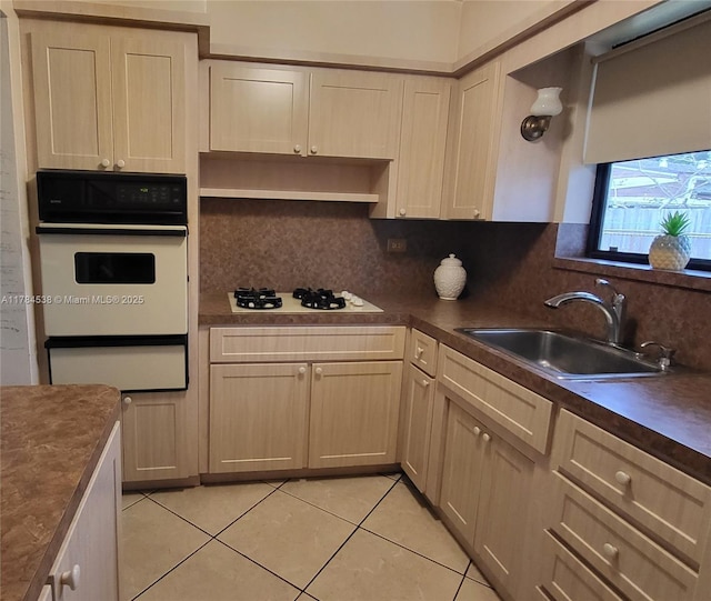 521 N 70th Way, Hollywood, FL 33024 - kitchen with white appliances, a sink, a warming drawer, light tile patterned flooring, and decorative backsplash