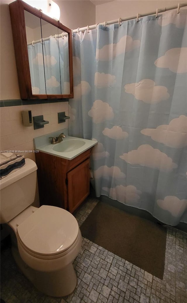 521 N 70th Way, Hollywood, FL 33024 - bathroom with toilet, vanity, curtained shower, and tile walls