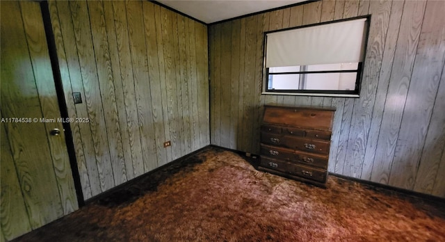 521 N 70th Way, Hollywood, FL 33024 - spare room featuring wood walls, carpet flooring, and baseboards