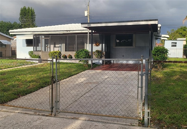 521 N 70th Way, Hollywood, FL 33024 - view of front of home with a gate and brick siding