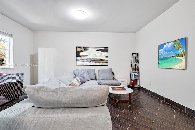 359 Meridian Ave Unit A105, Miami Beach, FL 33139 - living room with baseboards and dark wood-style floors