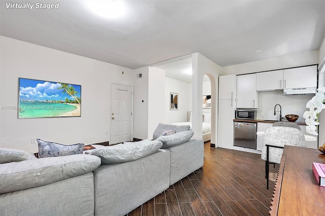 359 Meridian Ave Unit A105, Miami Beach, FL 33139 - living room with dark wood-style flooring and arched walkways