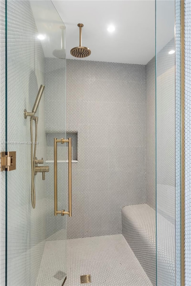 bathroom featuring a shower stall