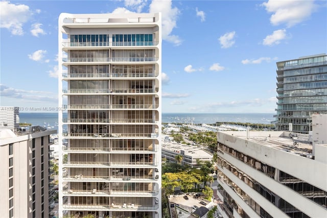 view of property featuring a city view and a water view