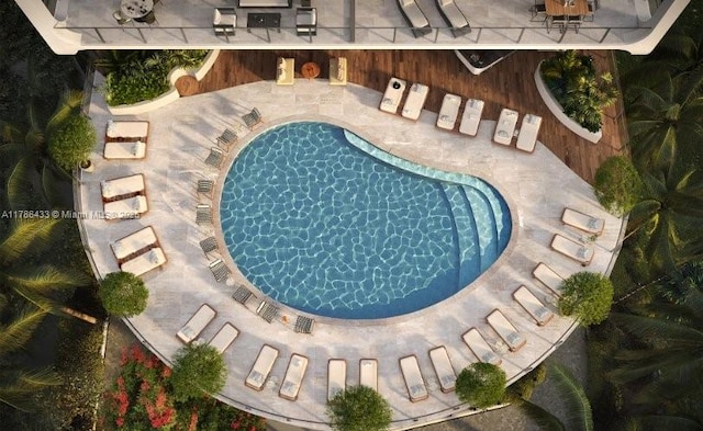 community pool with a patio area