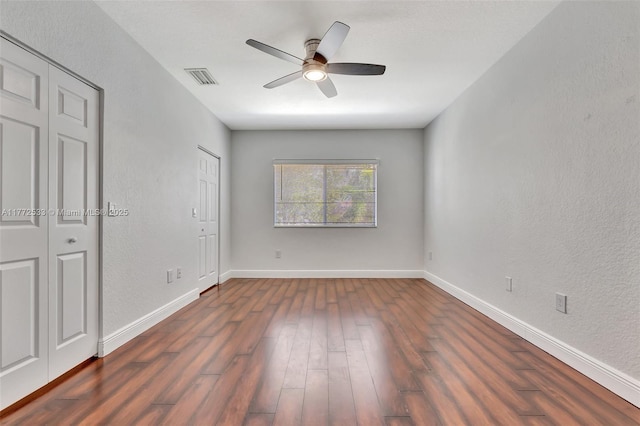 7848 Catalina Cir Unit 7848, Tamarac, FL 33321 - unfurnished bedroom with dark wood-style floors, baseboards, and a ceiling fan