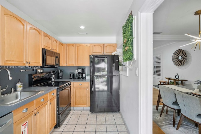 509 SW 13th St, Fort Lauderdale, FL 33315 - kitchen with a sink, black appliances, light brown cabinetry, light tile patterned floors, and visible vents