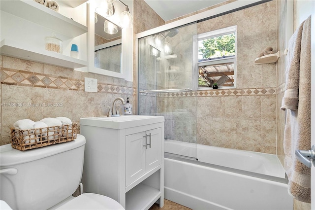 509 SW 13th St, Fort Lauderdale, FL 33315 - full bath with tile walls, vanity, shower / bath combination with glass door, and toilet