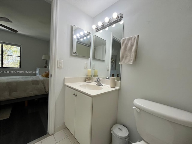 22701 SW 88th Pl Unit 203-9, Cutler Bay, FL 33190 - ensuite bathroom featuring vanity, a ceiling fan, and tile patterned floors