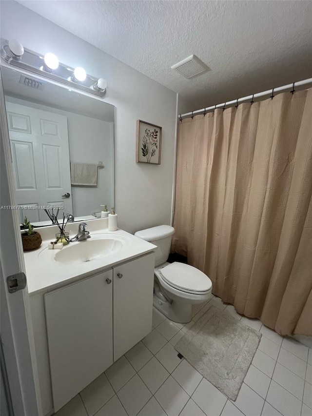 22701 SW 88th Pl Unit 203-9, Cutler Bay, FL 33190 - bathroom with vanity, tile patterned flooring, and a textured ceiling
