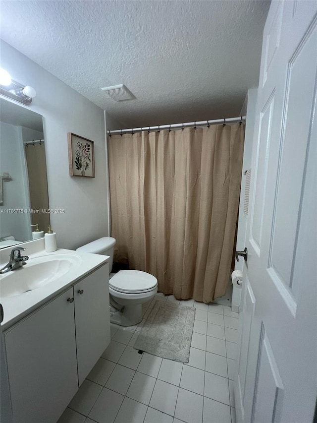 22701 SW 88th Pl Unit 203-9, Cutler Bay, FL 33190 - bathroom featuring vanity, a textured ceiling, and tile patterned flooring