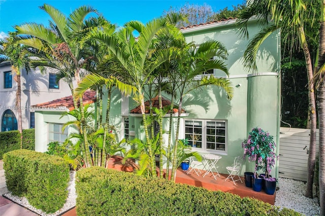 837 Espanola Way, Miami Beach, FL 33139 - exterior space featuring a tiled roof and stucco siding