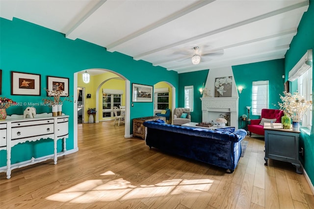 837 Espanola Way, Miami Beach, FL 33139 - living area featuring arched walkways, wood finished floors, and beam ceiling