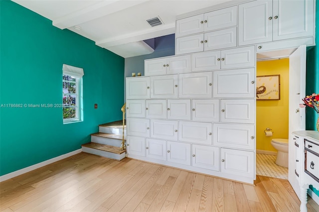 837 Espanola Way, Miami Beach, FL 33139 - garage featuring baseboards and visible vents