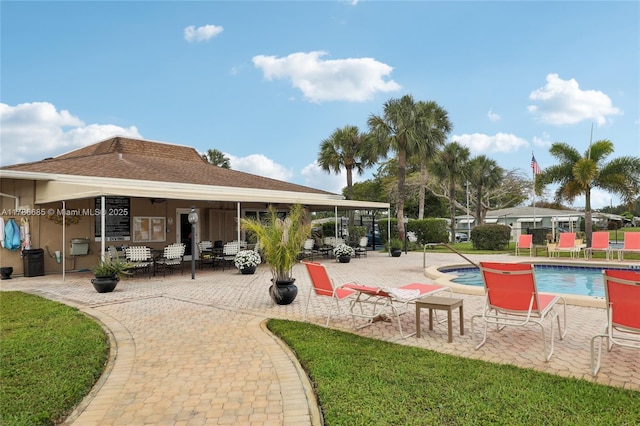 exterior space featuring a patio and a pool