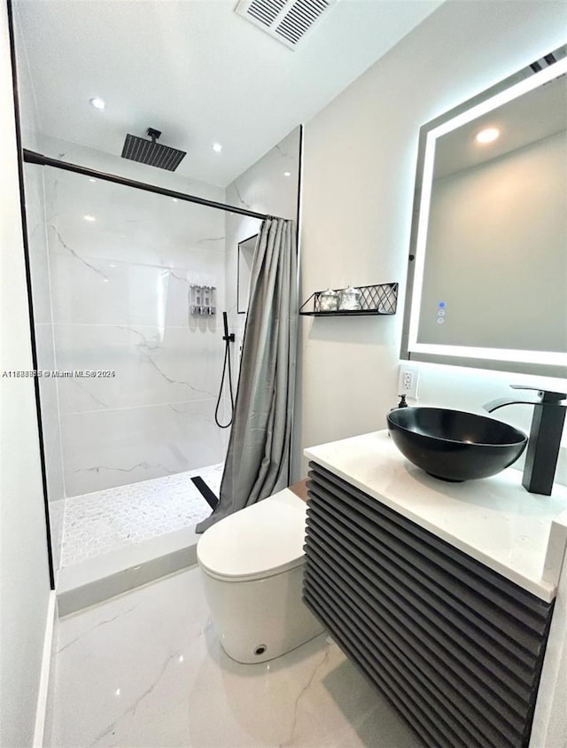 2360 SW 12th St, Miami, FL 33135 - full bath with a shower stall, marble finish floor, toilet, vanity, and visible vents