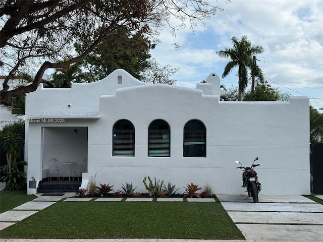 2360 SW 12th St, Miami, FL 33135 - mediterranean / spanish-style home with stucco siding and a front yard