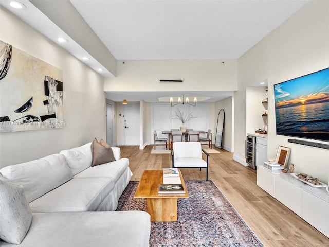 20191 E Country Club Dr Unit 311, Aventura, FL 33180 - living area with light wood-style flooring, a notable chandelier, wine cooler, visible vents, and recessed lighting