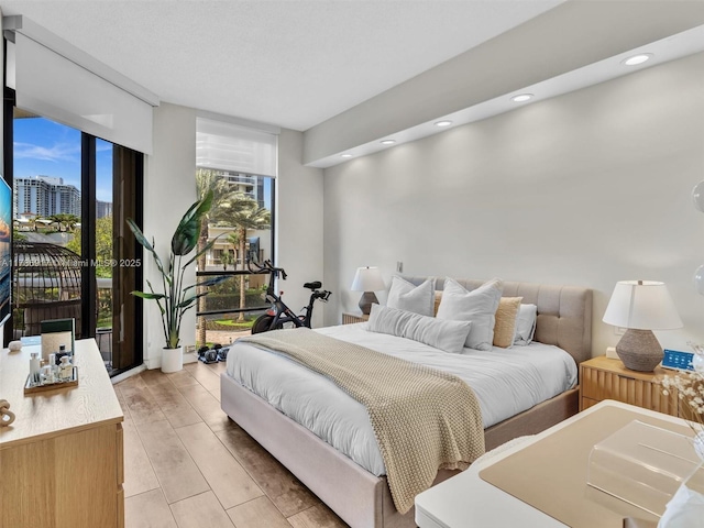 20191 E Country Club Dr Unit 311, Aventura, FL 33180 - bedroom with light wood-type flooring and recessed lighting