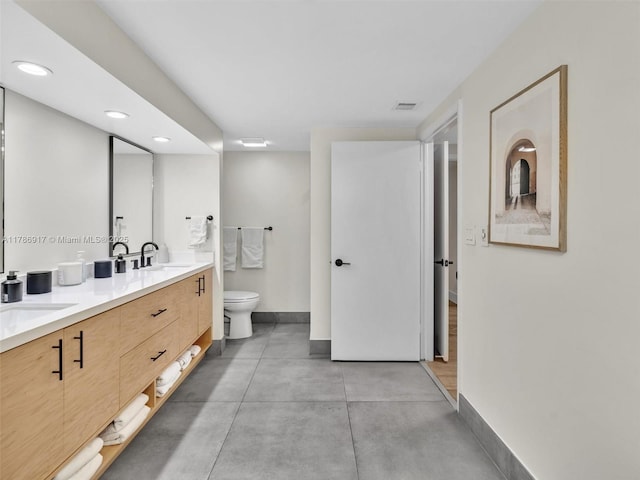 20191 E Country Club Dr Unit 311, Aventura, FL 33180 - full bath featuring visible vents, toilet, a sink, baseboards, and finished concrete floors