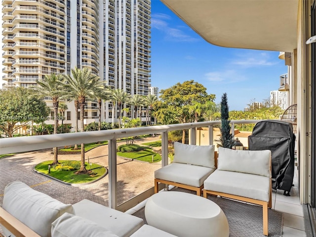 20191 E Country Club Dr Unit 311, Aventura, FL 33180 - balcony with grilling area and outdoor lounge area
