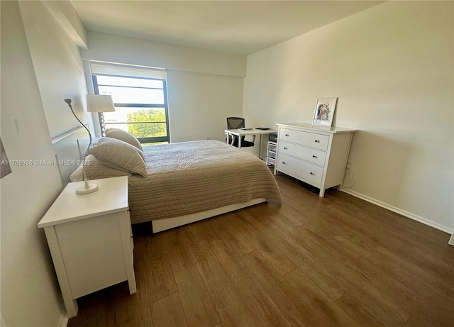 575 Crandon Blvd Unit 707, Key Biscayne, FL 33149 - bedroom featuring baseboards and dark wood-type flooring