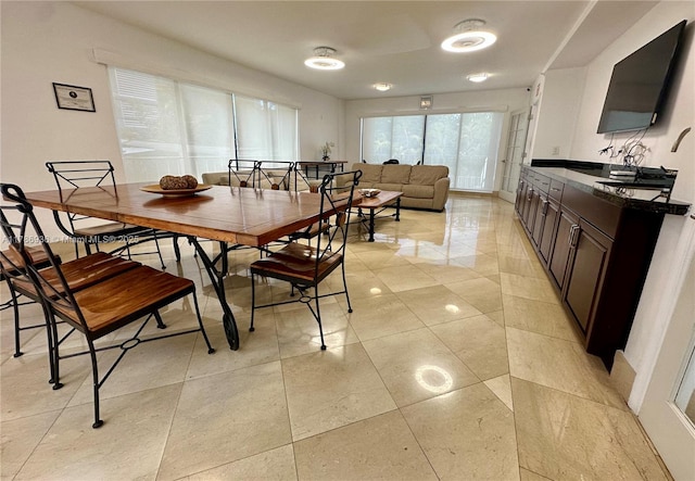 575 Crandon Blvd Unit 707, Key Biscayne, FL 33149 - dining space featuring baseboards and light tile patterned floors