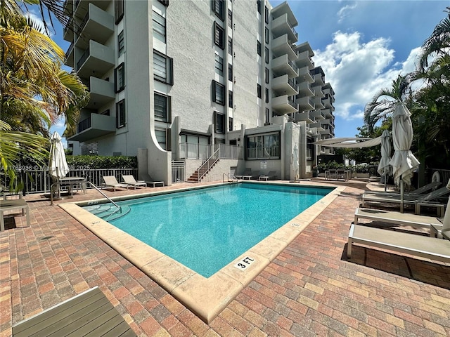 575 Crandon Blvd Unit 707, Key Biscayne, FL 33149 - pool with fence, stairs, and a patio